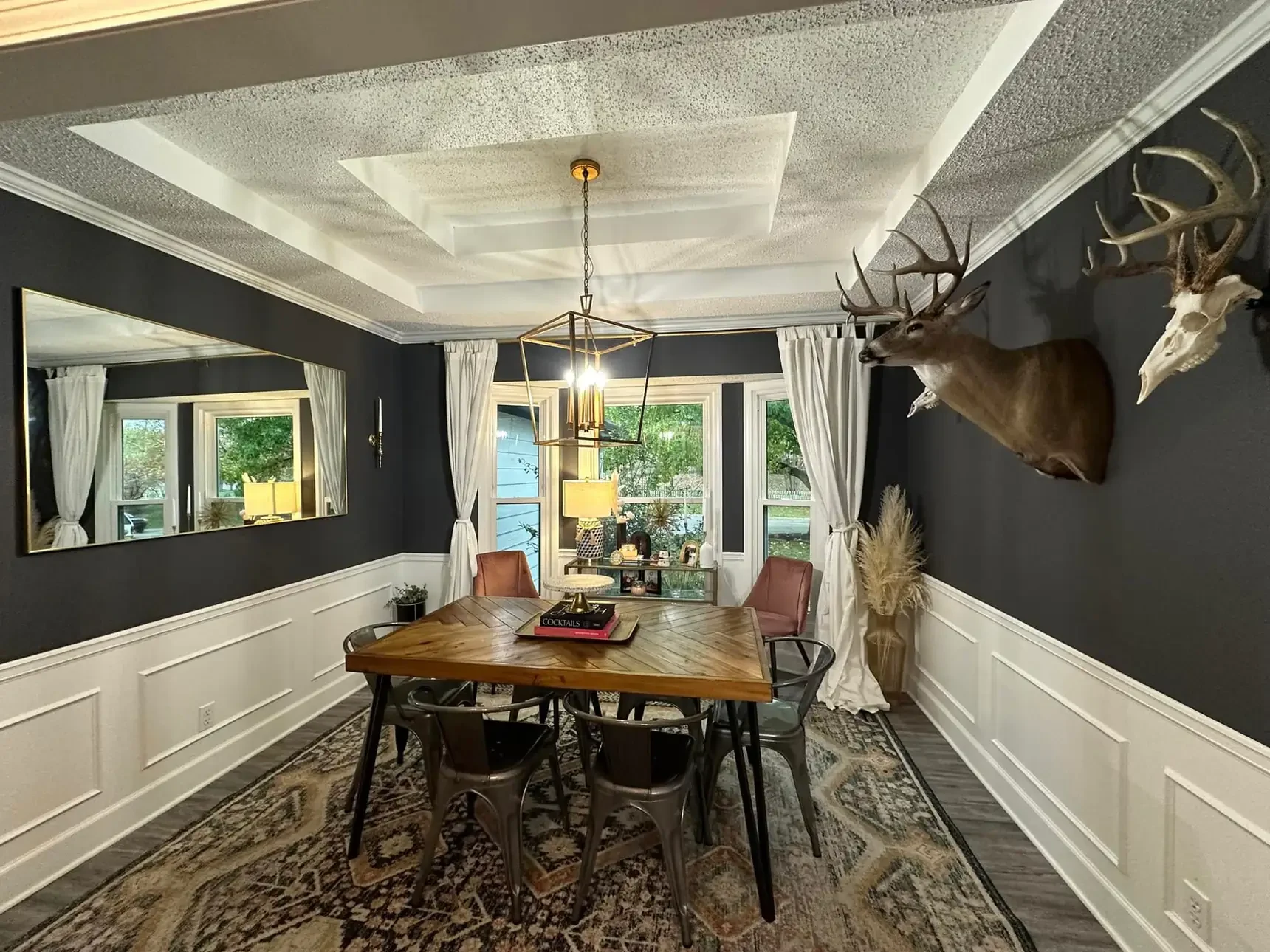Dining room with a wooden table and ceiling beams
